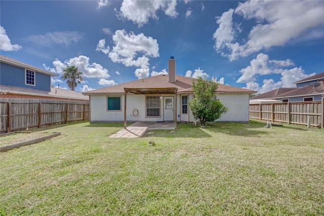 7313 Prairie Dr, Corpus Christi, TX 78413 - back of house with a patio area, a fenced backyard, and a chimney