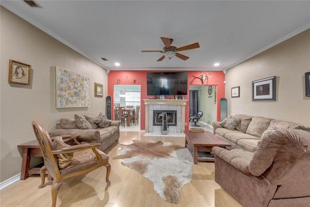 7313 Prairie Dr, Corpus Christi, TX 78413 - living area with light wood-style floors, ceiling fan, crown molding, recessed lighting, and a fireplace