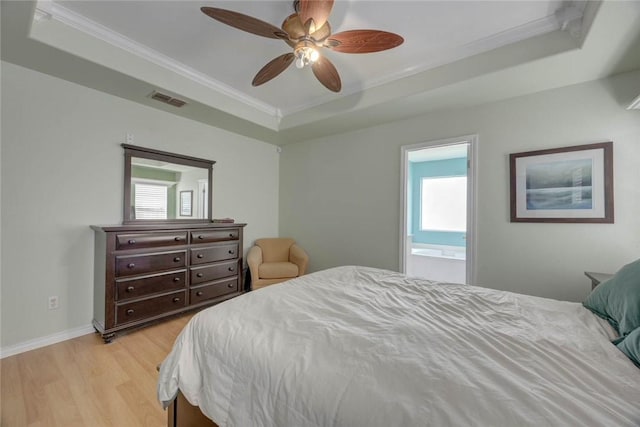 7313 Prairie Dr, Corpus Christi, TX 78413 - bedroom with a tray ceiling, ornamental molding, light wood-type flooring, and ceiling fan