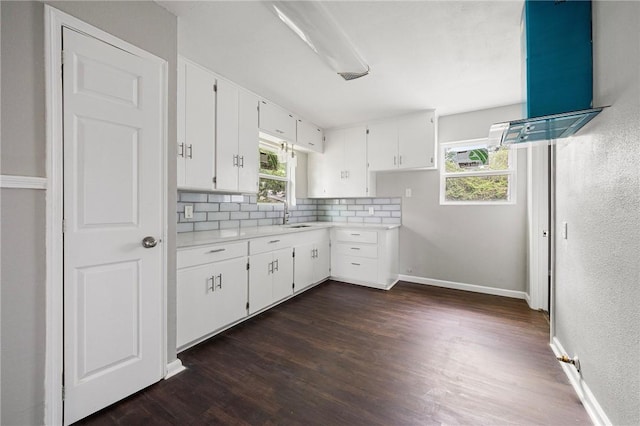 3740 Brooks Dr, Corpus Christi, TX 78408 - kitchen with light countertops, backsplash, and dark wood-style flooring