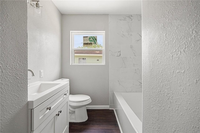 3740 Brooks Dr, Corpus Christi, TX 78408 - bathroom with vanity, wood finished floors, and a textured wall