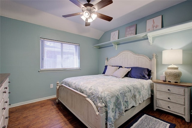 bedroom with ceiling fan, dark hardwood / wood-style floors, and vaulted ceiling