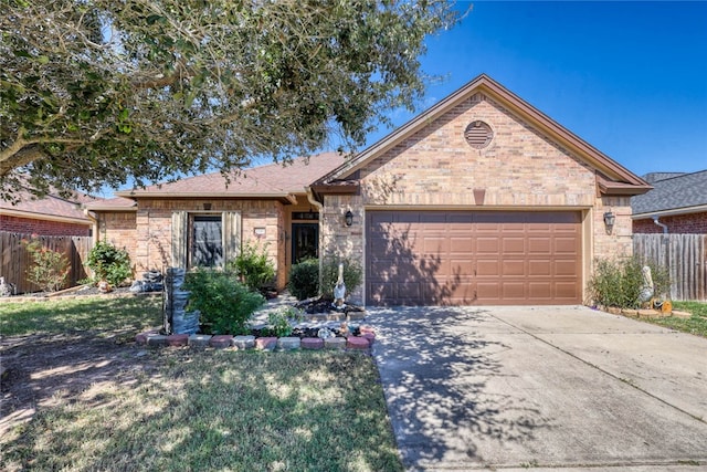 single story home featuring a garage and a front yard