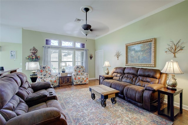 living room with ornamental molding, hardwood / wood-style floors, and ceiling fan