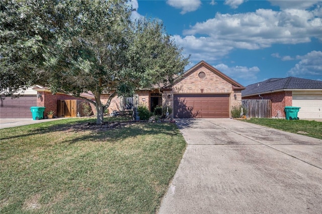 single story home featuring a garage and a front lawn