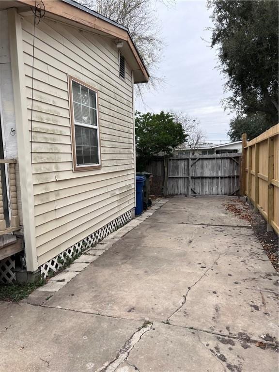 view of side of property with a patio