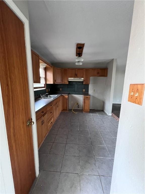 kitchen with sink and tile patterned floors