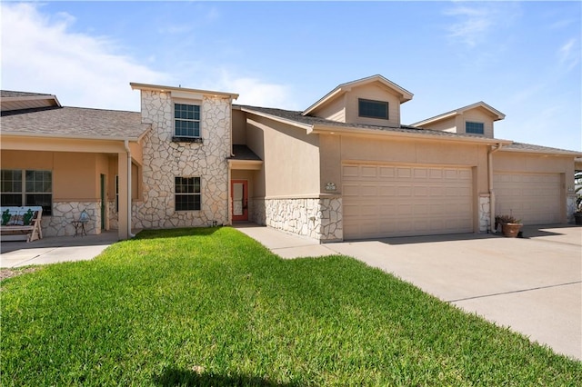 view of front of property featuring a front yard, an attached garage, stucco siding, concrete driveway, and stone siding