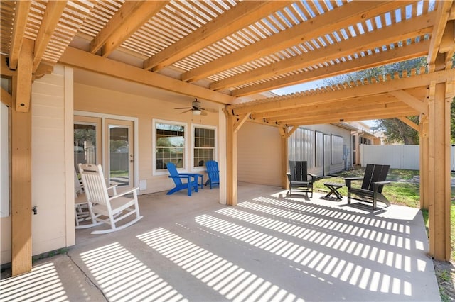 view of patio with a pergola, ceiling fan, and fence