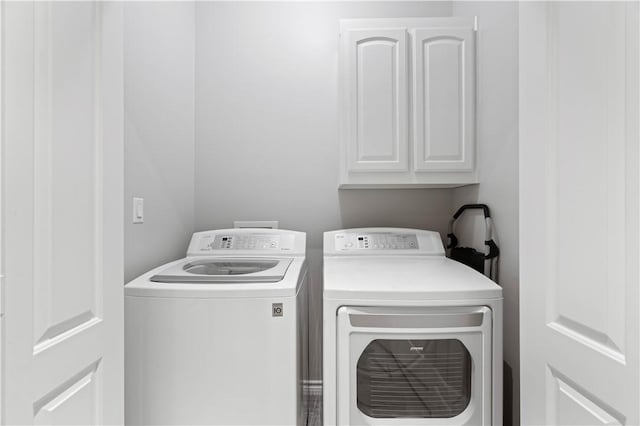 laundry area featuring cabinet space and washer and dryer