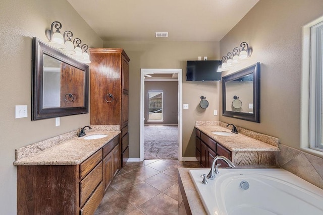 6901 Ridgeline Ct, Corpus Christi, TX 78413 - full bath featuring a garden tub, vanity, baseboards, and tile patterned flooring