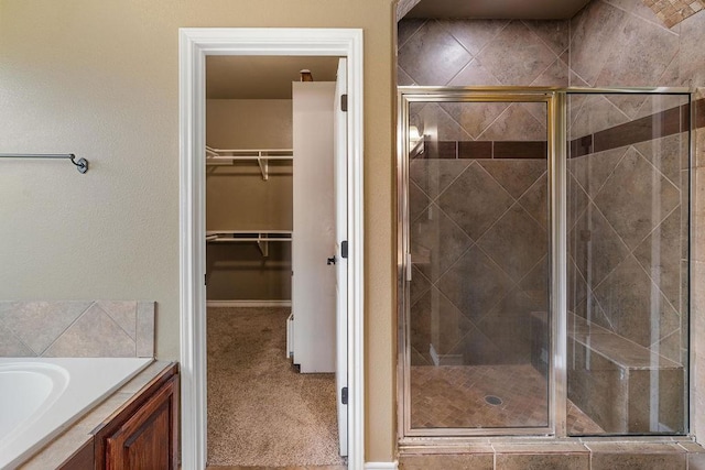 6901 Ridgeline Ct, Corpus Christi, TX 78413 - full bath with a shower stall, a spacious closet, vanity, and baseboards