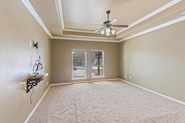 6901 Ridgeline Ct, Corpus Christi, TX 78413 - carpeted empty room with a tray ceiling, ceiling fan, ornamental molding, and baseboards