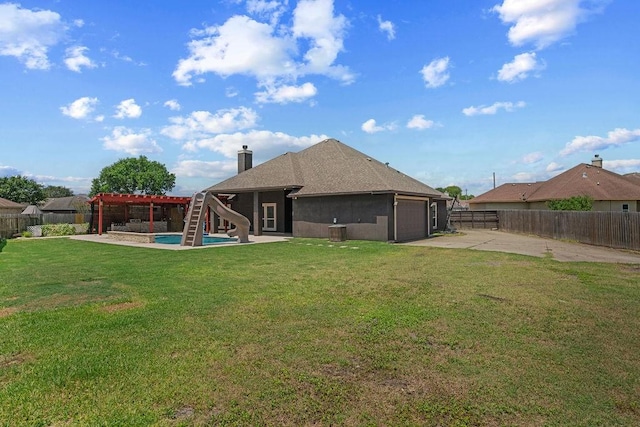 6901 Ridgeline Ct, Corpus Christi, TX 78413 - back of house with driveway, an attached garage, a patio, a chimney, and roof with shingles