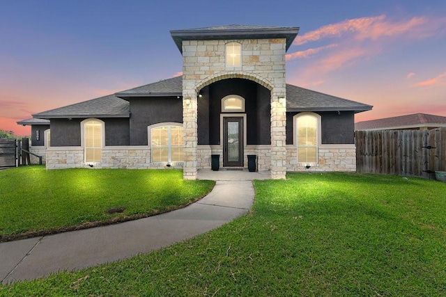 6901 Ridgeline Ct, Corpus Christi, TX 78413 - view of front of house featuring stone siding, a shingled roof, and stucco siding