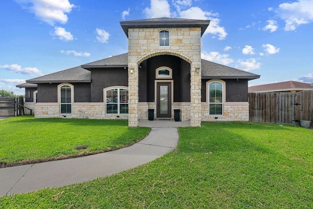 6901 Ridgeline Ct, Corpus Christi, TX 78413 - french country style house with stone siding, roof with shingles, and stucco siding