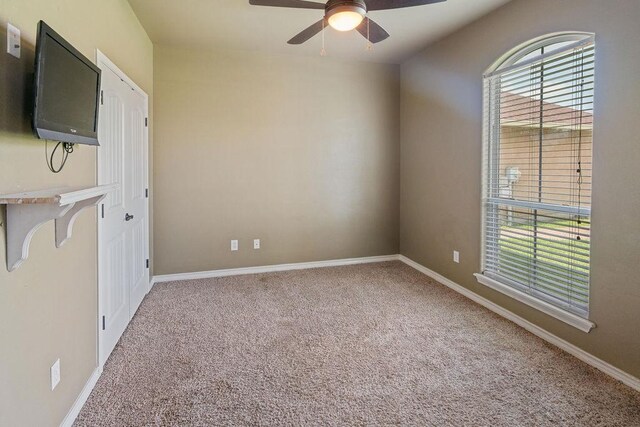 6901 Ridgeline Ct, Corpus Christi, TX 78413 - carpeted empty room featuring ceiling fan and baseboards