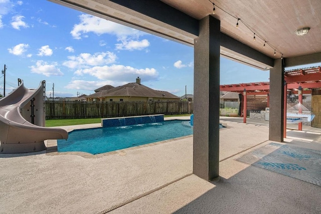 6901 Ridgeline Ct, Corpus Christi, TX 78413 - view of pool featuring a water slide, a pergola, a fenced backyard, and a patio area