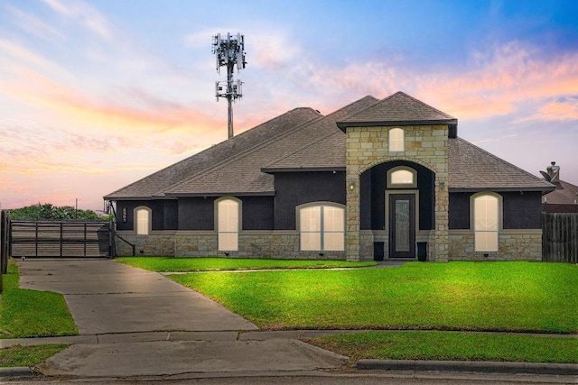 6901 Ridgeline Ct, Corpus Christi, TX 78413 - french country style house featuring stone siding, roof with shingles, and stucco siding