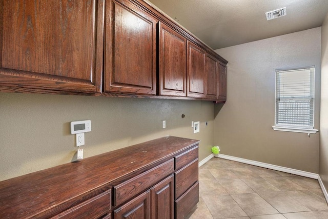 6901 Ridgeline Ct, Corpus Christi, TX 78413 - laundry area featuring cabinet space, hookup for a washing machine, baseboards, and light tile patterned floors