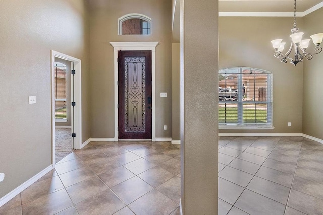 6901 Ridgeline Ct, Corpus Christi, TX 78413 - foyer entrance featuring plenty of natural light, tile patterned flooring, a chandelier, baseboards, and a towering ceiling