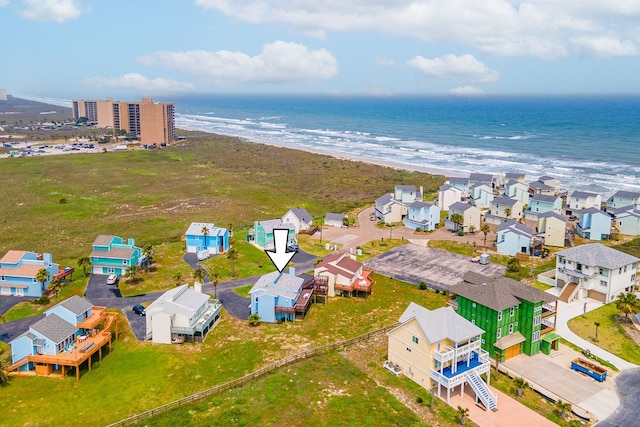 drone / aerial view with a view of the beach and a water view