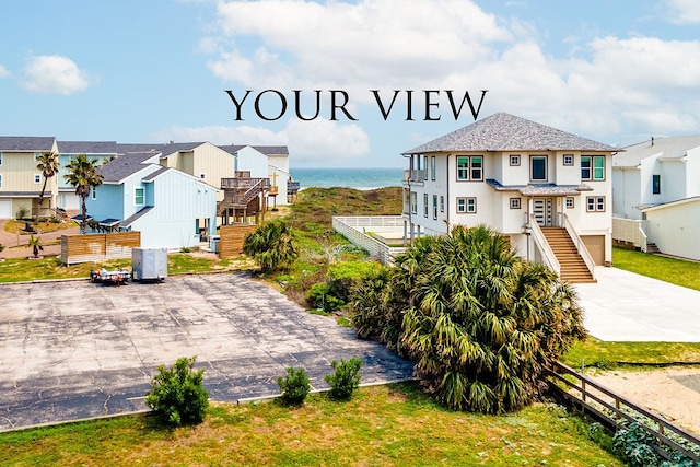 view of front of property with a water view