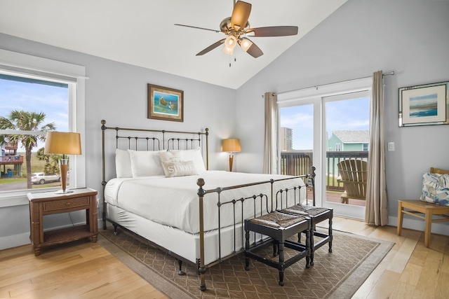 bedroom featuring access to exterior, light wood-type flooring, ceiling fan, and high vaulted ceiling