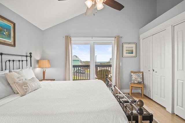 bedroom with light hardwood / wood-style flooring, vaulted ceiling, ceiling fan, and access to exterior