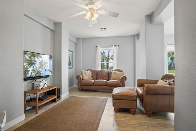 living room featuring light hardwood / wood-style floors and ceiling fan