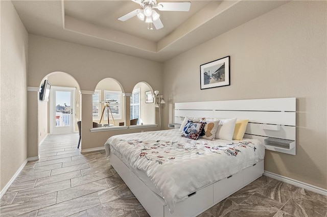 13953 Dasmarinas Dr, Corpus Christi, TX 78418 - bedroom with baseboards, a raised ceiling, and a ceiling fan