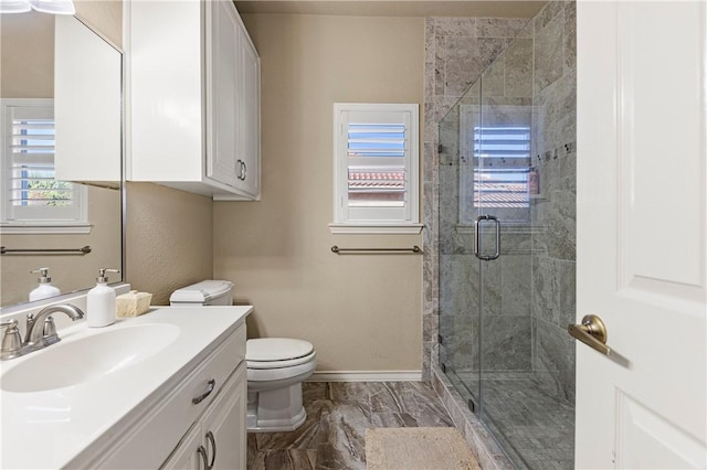 13953 Dasmarinas Dr, Corpus Christi, TX 78418 - full bath with toilet, vanity, a stall shower, baseboards, and marble look tiles