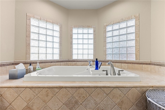 bathroom featuring a relaxing tiled tub