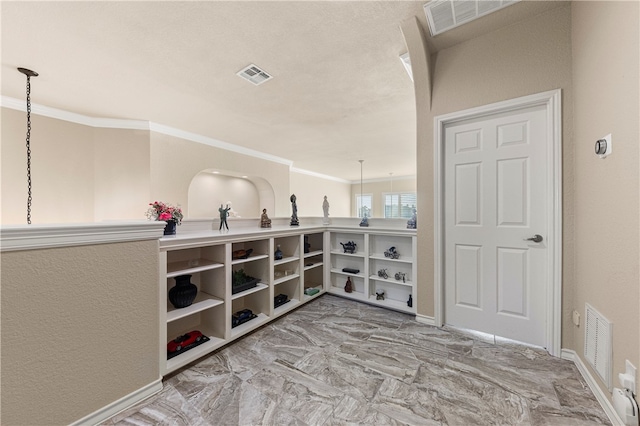 interior space featuring crown molding