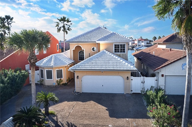 mediterranean / spanish-style house with a garage