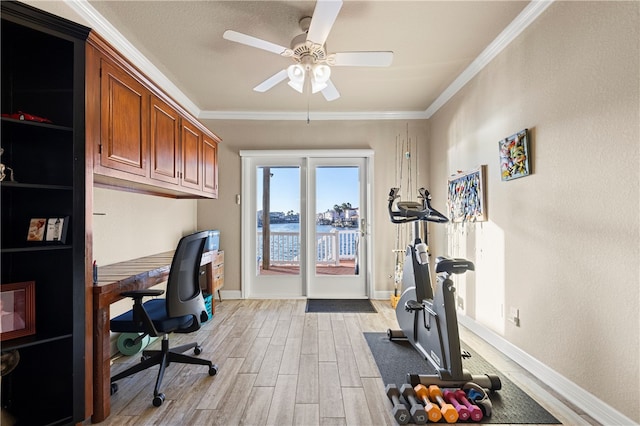 home office with ceiling fan, a water view, light wood-type flooring, and crown molding