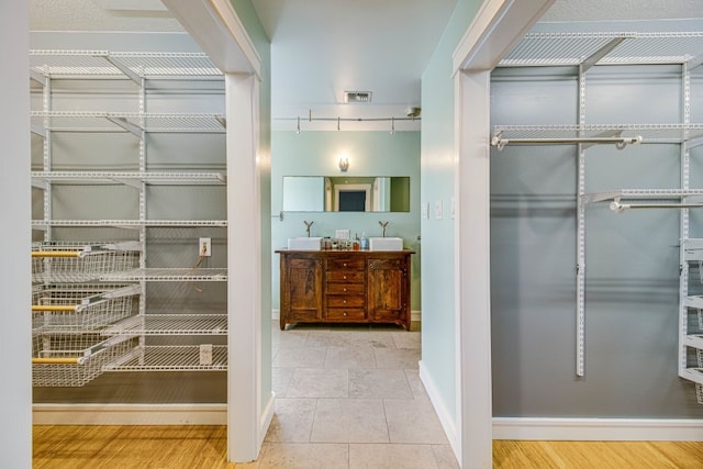 bathroom featuring tile patterned flooring and vanity