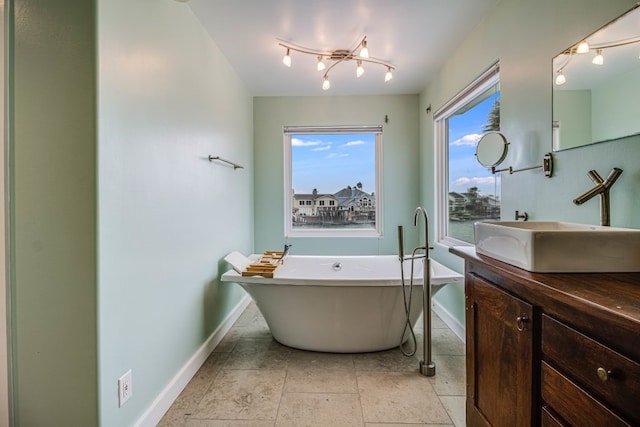 bathroom with vanity and a tub to relax in