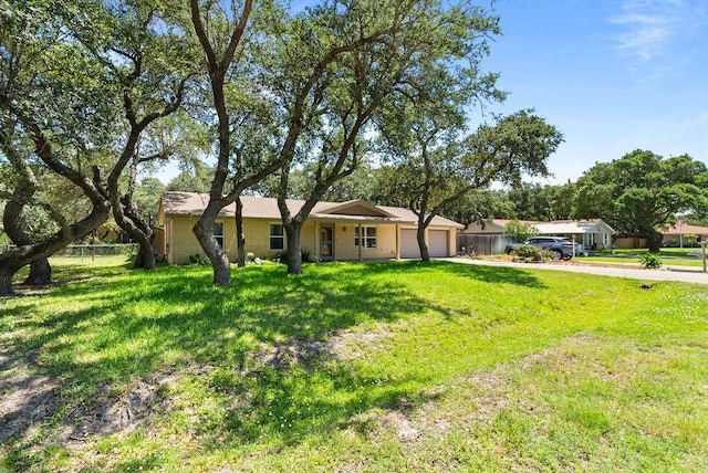 116 Greenway Ln, Rockport, TX 78382 - ranch-style home with a garage, a front lawn, and driveway