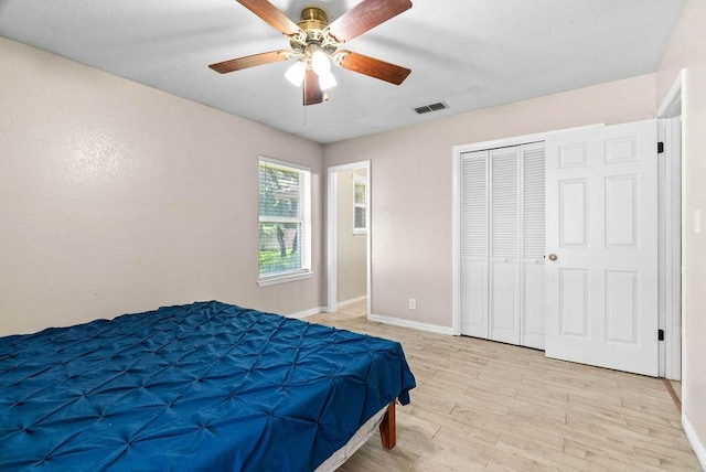 116 Greenway Ln, Rockport, TX 78382 - bedroom featuring light wood finished floors, ceiling fan, and a closet