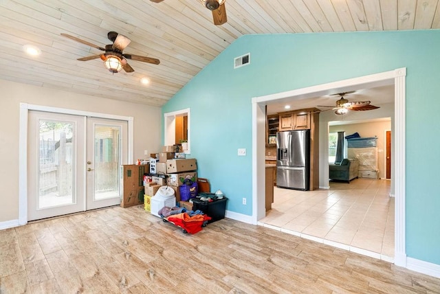 116 Greenway Ln, Rockport, TX 78382 - empty room with a ceiling fan, french doors, lofted ceiling, plenty of natural light, and light wood-style flooring