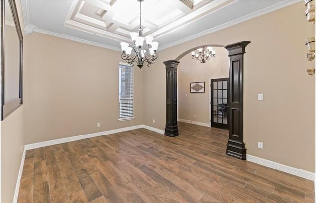2013 Magnolia Falls Dr, Corpus Christi, TX 78415 - empty room featuring ornate columns, arched walkways, wood finished floors, and a notable chandelier