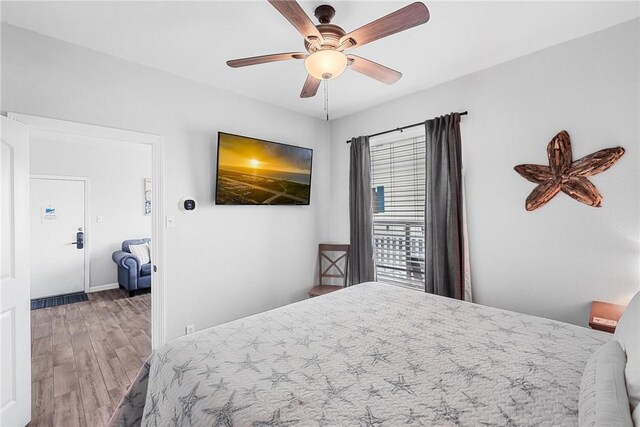 14721 Whitecap Blvd Unit 115, Corpus Christi, TX 78418 - bedroom with wood finished floors and ceiling fan
