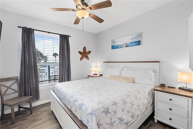 14721 Whitecap Blvd Unit 115, Corpus Christi, TX 78418 - bedroom with dark wood-type flooring and ceiling fan