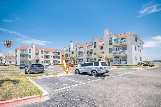 14721 Whitecap Blvd Unit 115, Corpus Christi, TX 78418 - view of apartment building / complex featuring uncovered parking