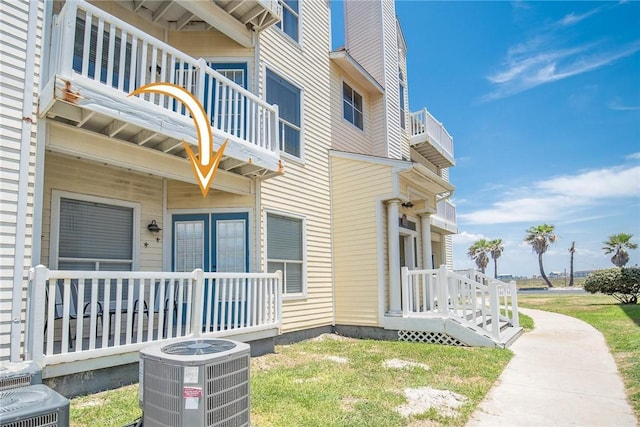 14721 Whitecap Blvd Unit 115, Corpus Christi, TX 78418 - view of side of home with a balcony and a chimney