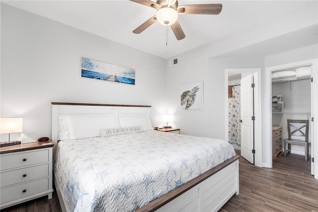 14721 Whitecap Blvd Unit 115, Corpus Christi, TX 78418 - bedroom featuring dark wood finished floors, a walk in closet, a ceiling fan, and a closet