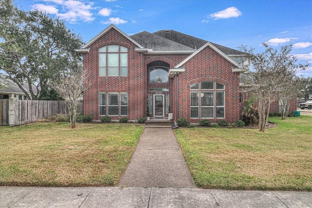 view of property with a front lawn