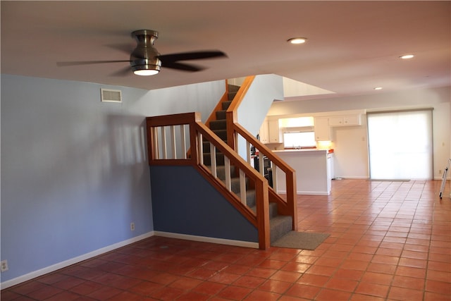 interior space with ceiling fan and plenty of natural light