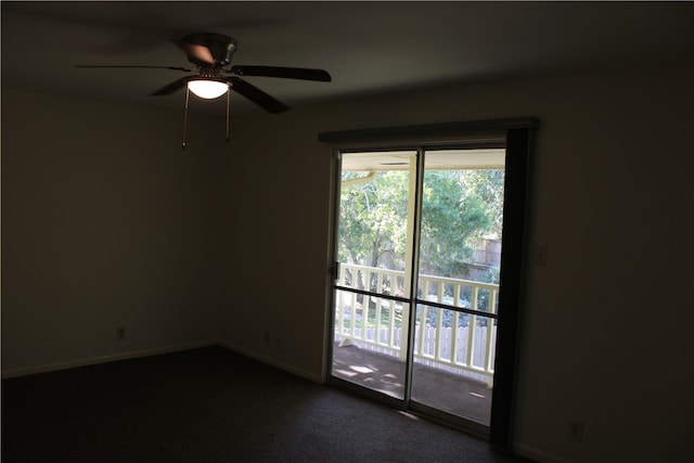 carpeted empty room featuring ceiling fan